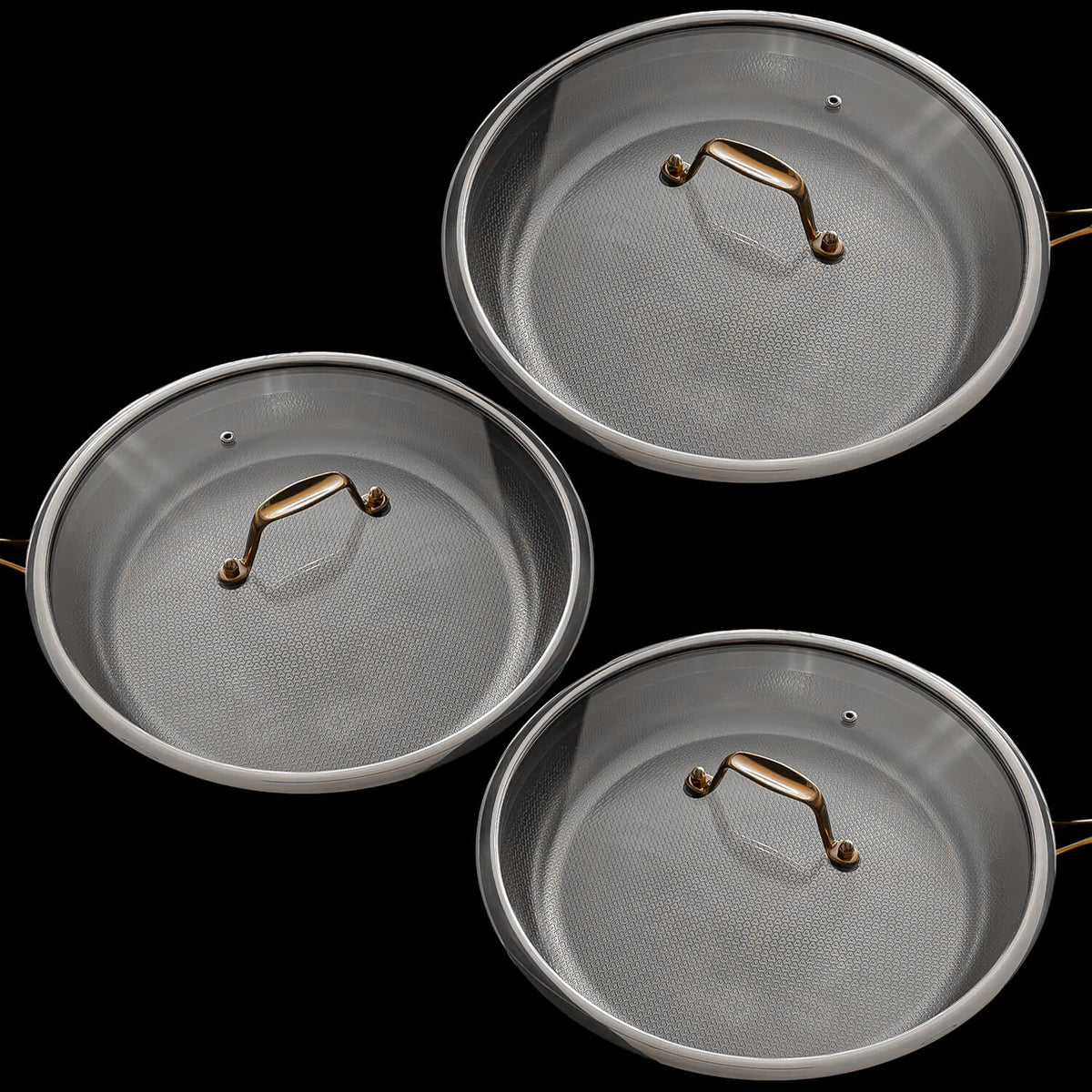 Three round Titanium steel saucepans with matching lids, each featuring a textured silver interior and a polished gold-toned handle, arranged on a solid black background.