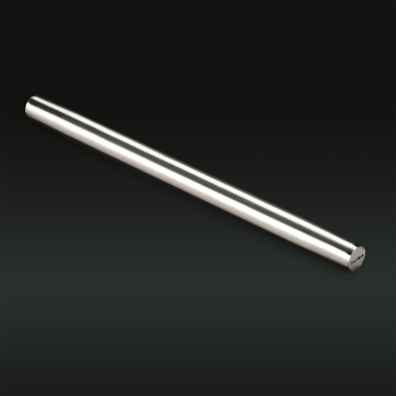 Silver cylindrical object on a black background